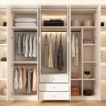 "White Manufactured Wood Wardrobe Closet with Gate, Interior Shelves, Casual Style, and Hanging Rod, 79"L x 23"W x 79"H"